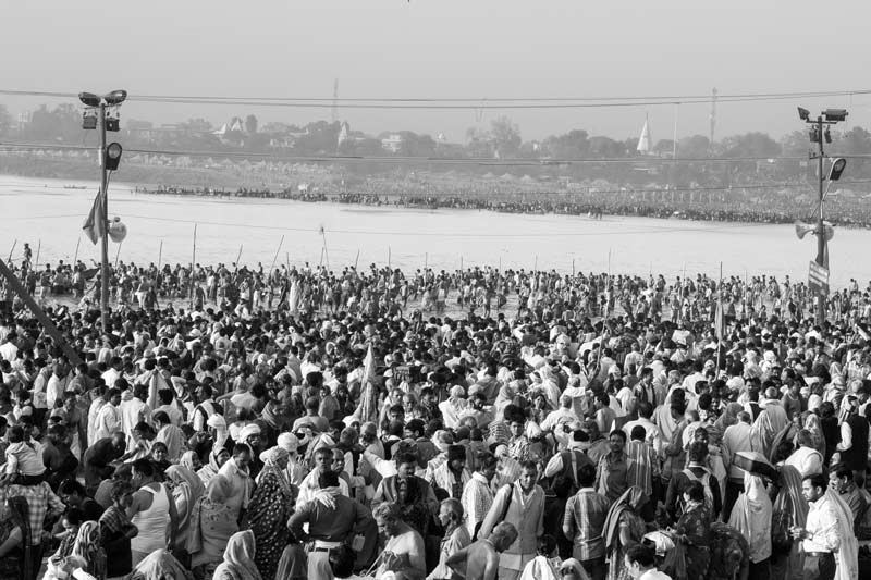 The connection between Water and Religion - Teeming millions performing sacred bath during Kumbh at Prayag (Allahabad), Uttar Pradesh